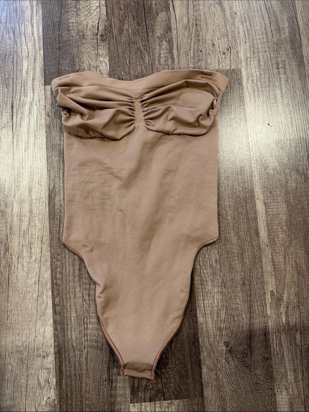 SKIMS Strapless Ruched Bodysuit in Taupe